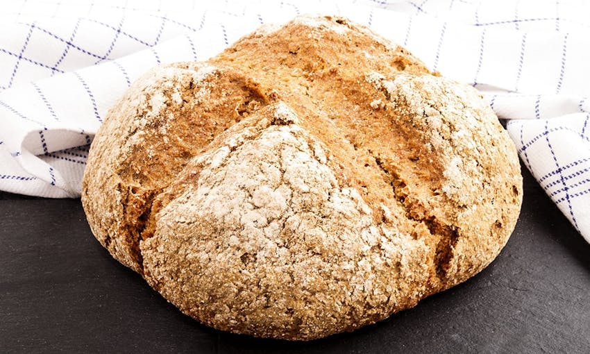 a loaf of freshly baked crusty soda bread 