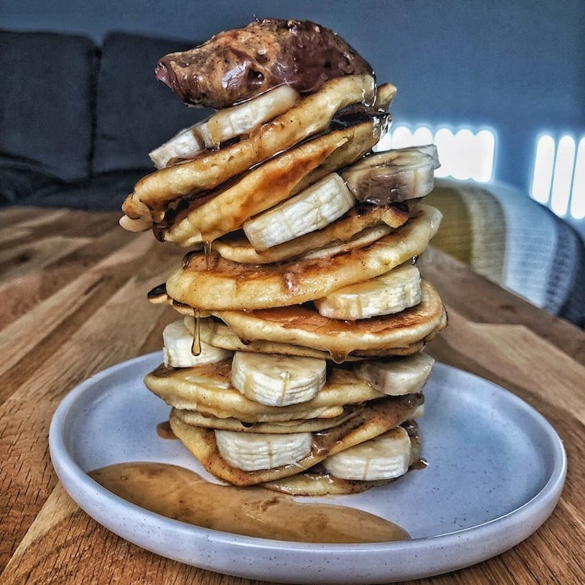 charlotte kidds giant pancake stack of chocolate banana peanut butter and syrup 