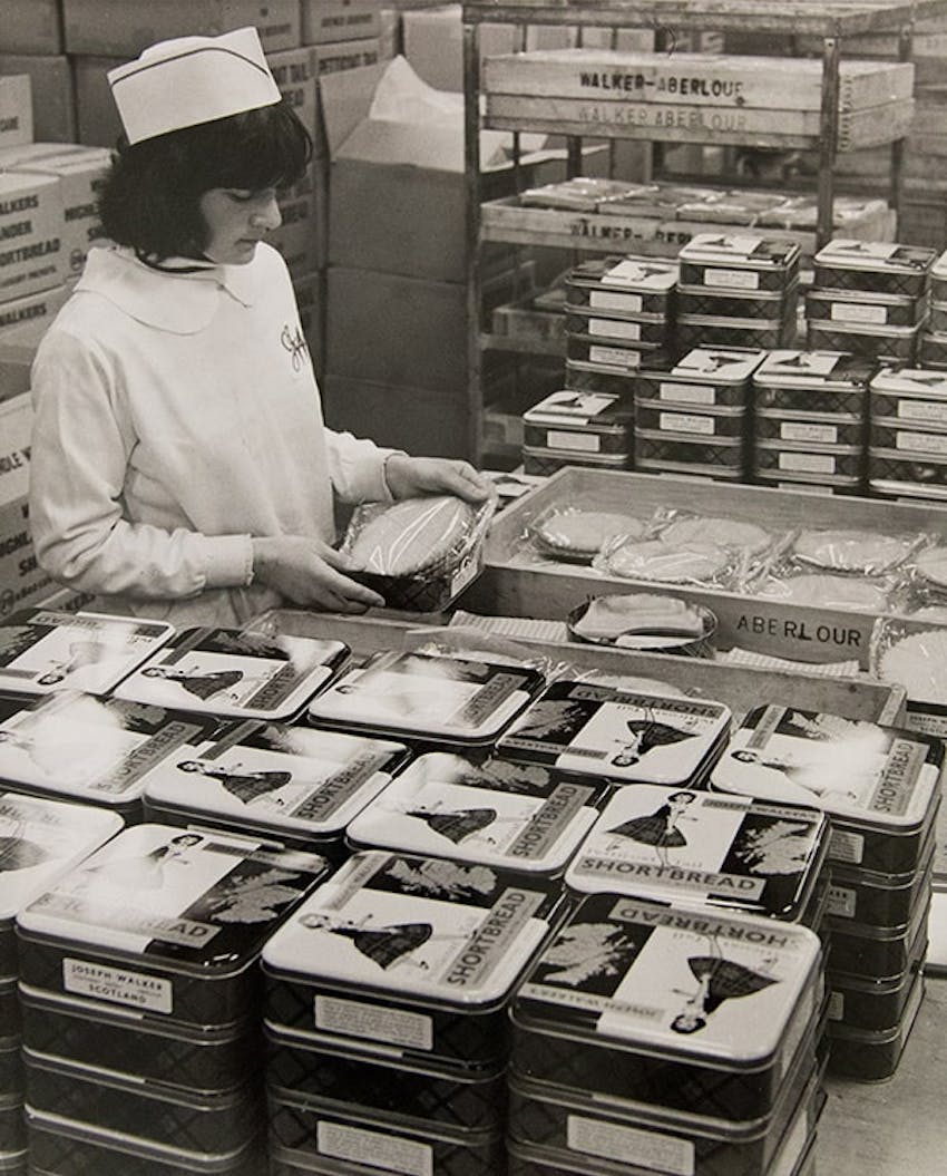 Lady packing the first shortbread tins at the original bakery