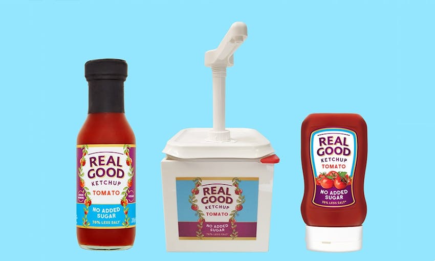 three different bottles of real good ketchup with a blue background