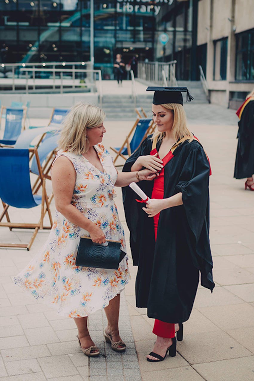 young girl and her mum at graduation ceremony 