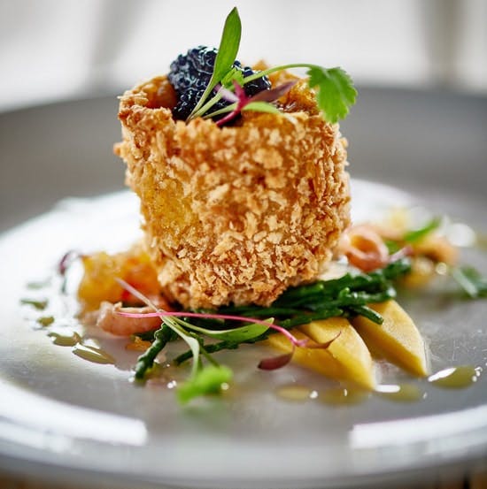 Coronation Brown Shrimp with Spiced Pineapple Chutney crispy brown shrimp on a bed of spiced pineapple chutney