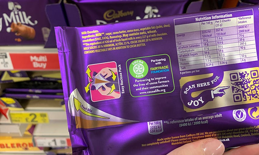 back of dairy milk family bar of chocolate showing the products ingredients, allergen information and nutritional content 