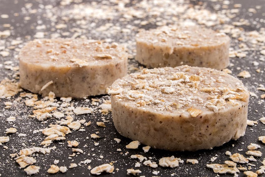 three irish white puddings dusted with oat flakes 