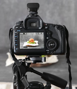 Image Capture Service a dslr camera on a tripod shooting a burger on a grey backdrop