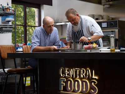 gordon lauder and head chef of central foods stand in the new innovation kitchen desk with lot 