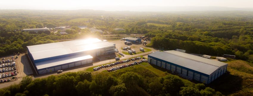 a drone view of the castell howell warehouse depot in the middle of the countryside in cross hands 