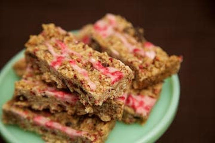 six slices of honeybuns oaty raspberry bar on top of cake tier tray 