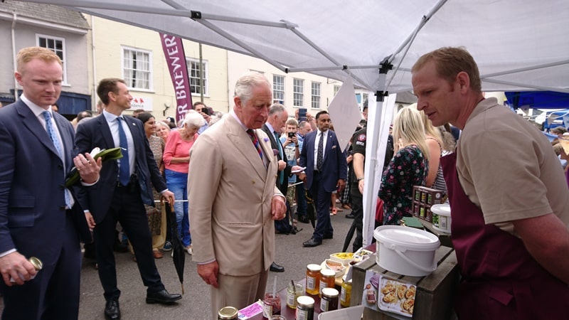 Otter Vale Farmers Market Stall, visited by Prince Charles prince charles browsing the products on the otter vale farmers market stall with a crowd watching