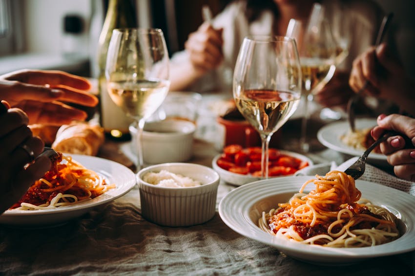 pasta dishes and wine in restaurant 