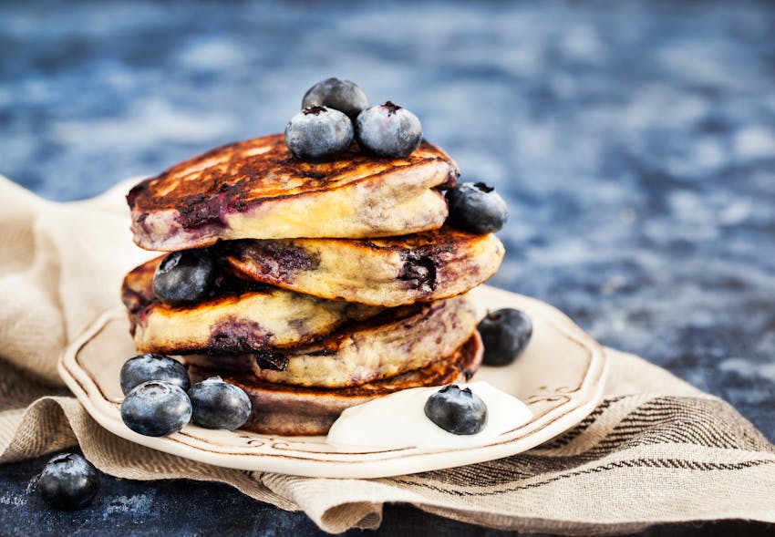 blueberry pancake stack with yoghurt and honey 