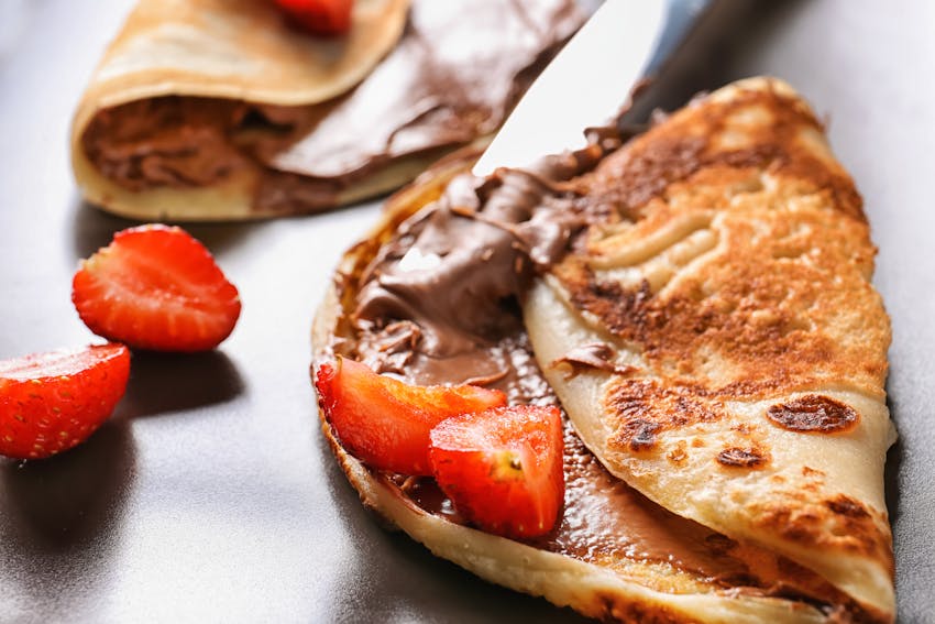 pancakes with low sugar chocolate spread and strawberries 