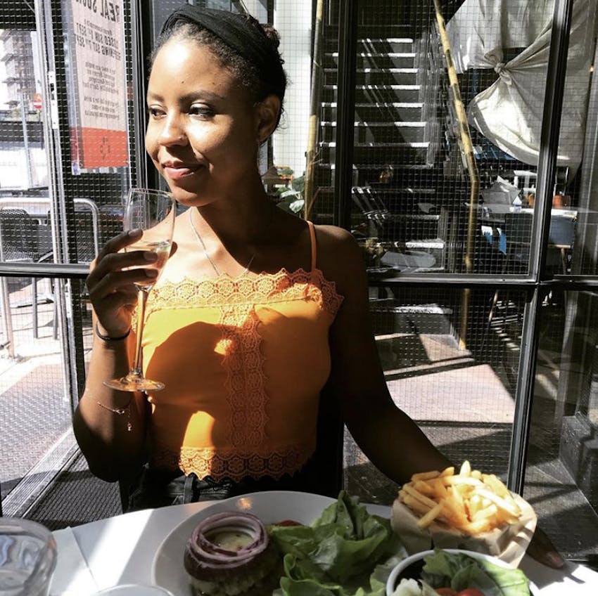 lindiwe lewis eating and drinking in a restaurant 
