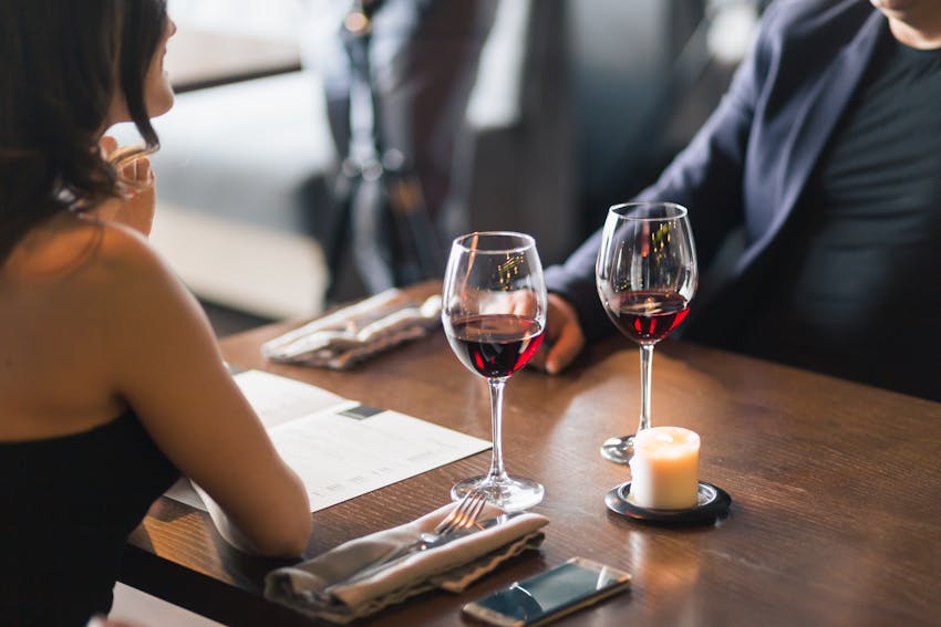 a man and a women on a date going out to eat 