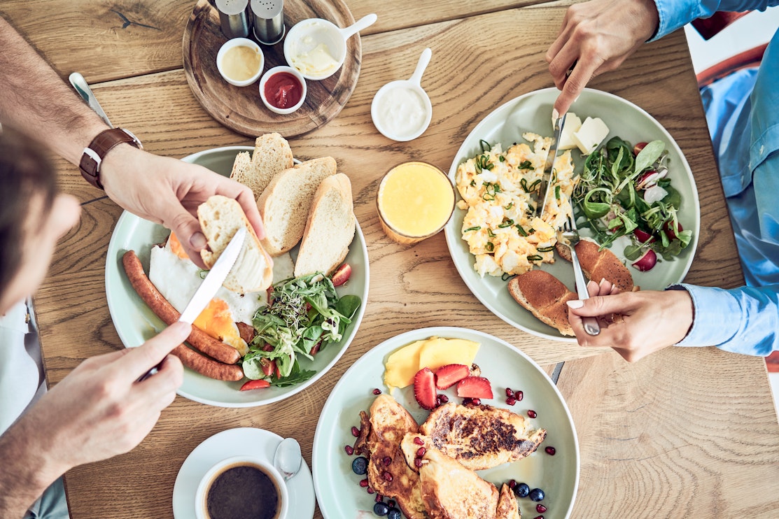 welcome to your inside guide on challenges faced by those with allergies two people eating out at a brunch restaurant