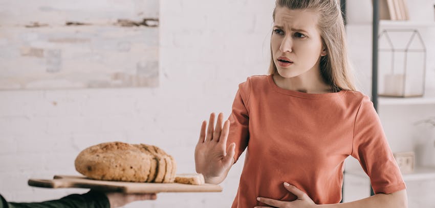 A woman suffering from a food allergy or intolerance 