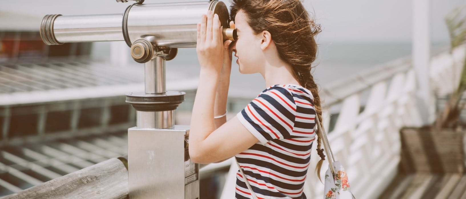 woman using telescope