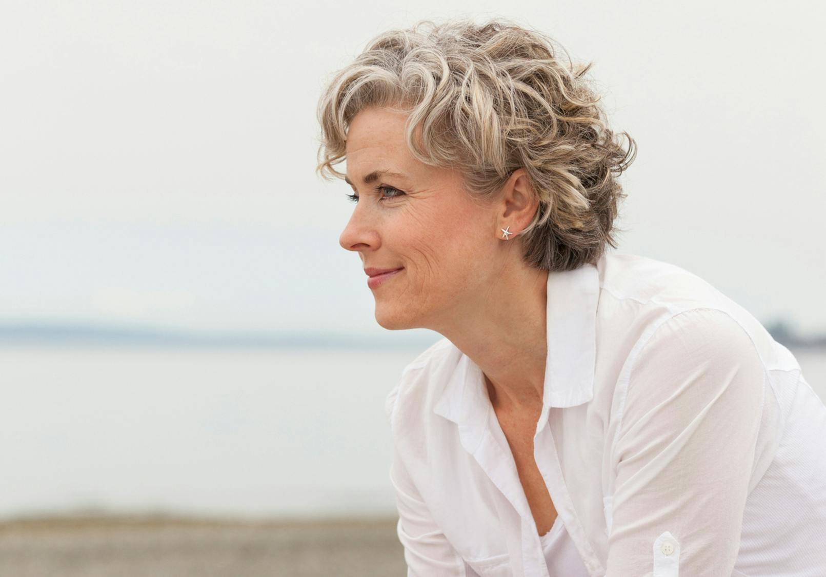Profile of beautiful older woman smiling.