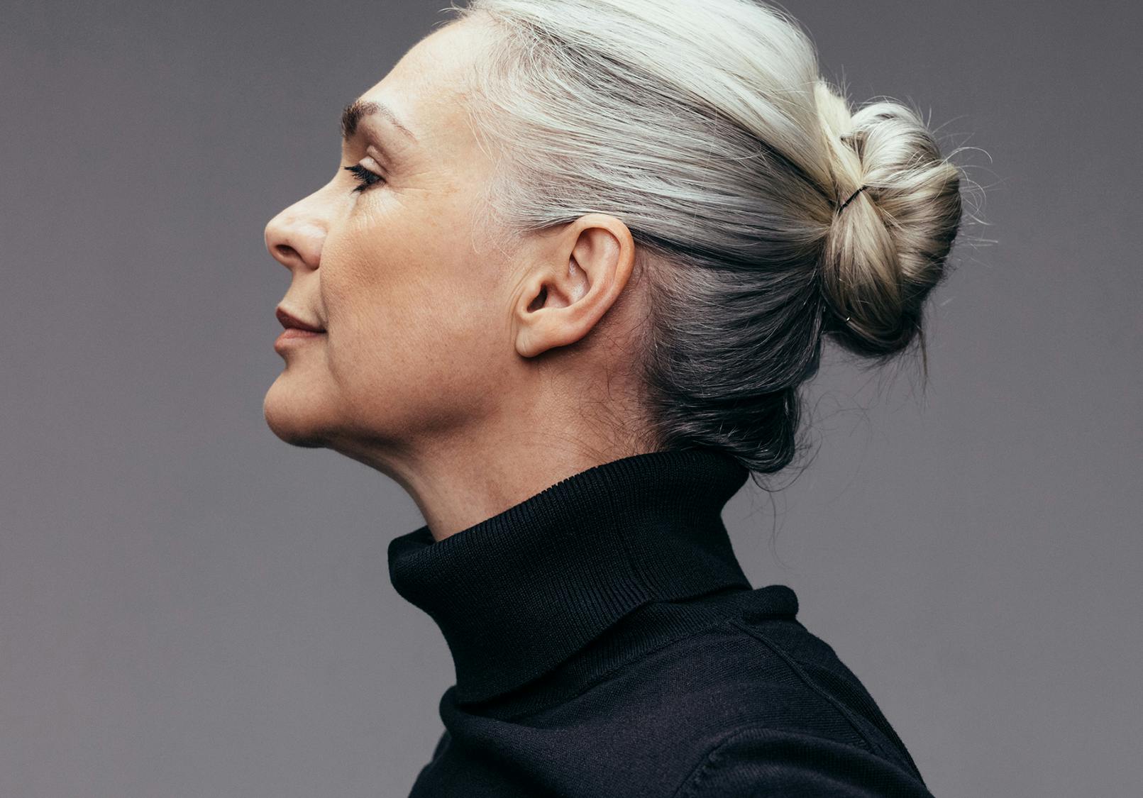 Profile of older woman with elegant ears.