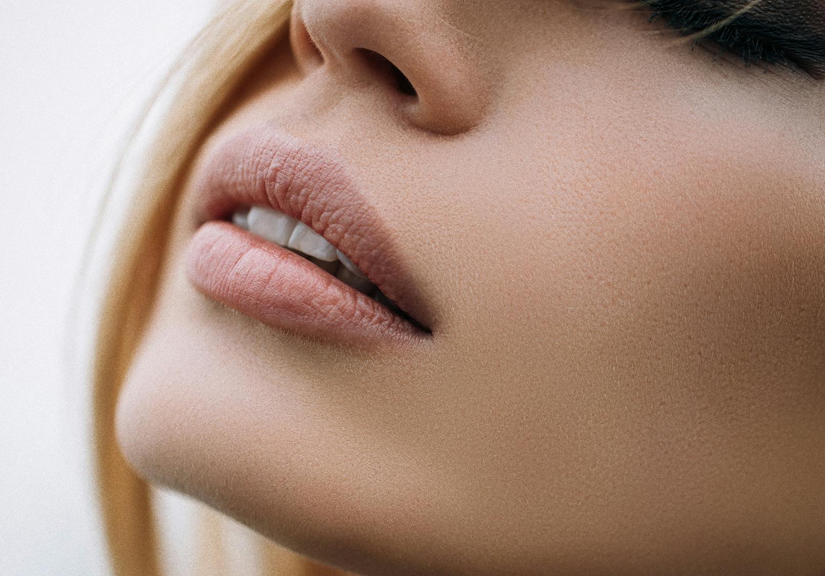 Close up on woman's beautifully chiseled chin.