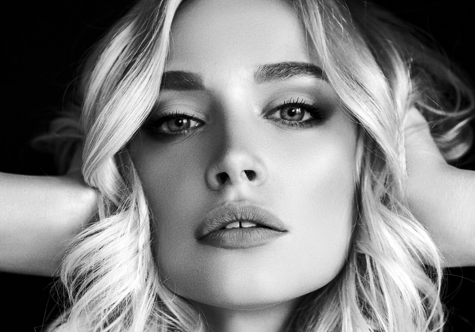 Close up on gorgeous woman's face with smooth and bright skin.