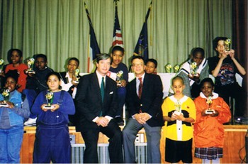 Dr. Antell Standing with a Group of Children