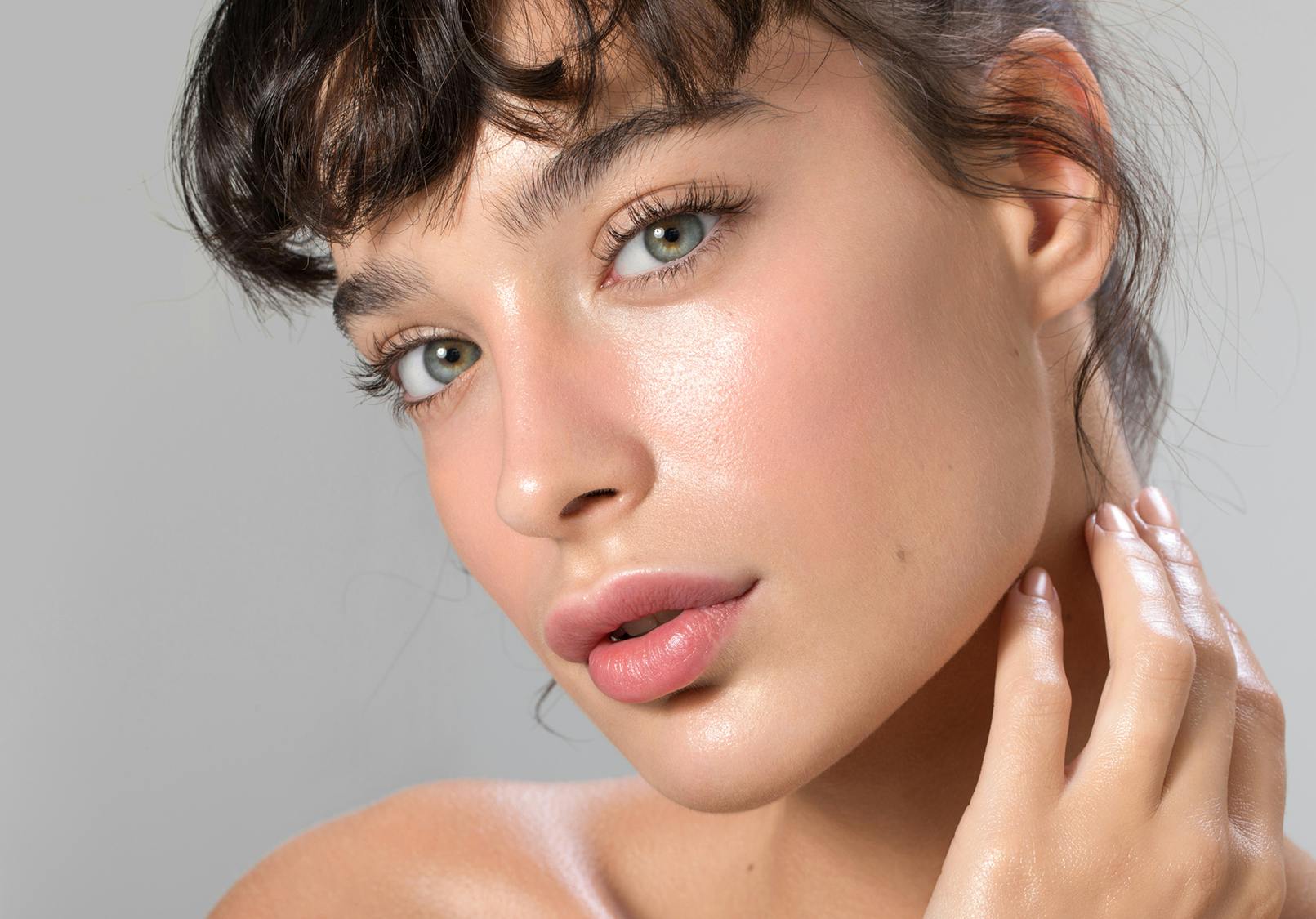 Close up on woman's face with smooth skin.