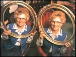Two Twins Holding a Frame in Front of their Heads