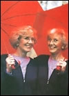 Two Women with Red Umbrellas