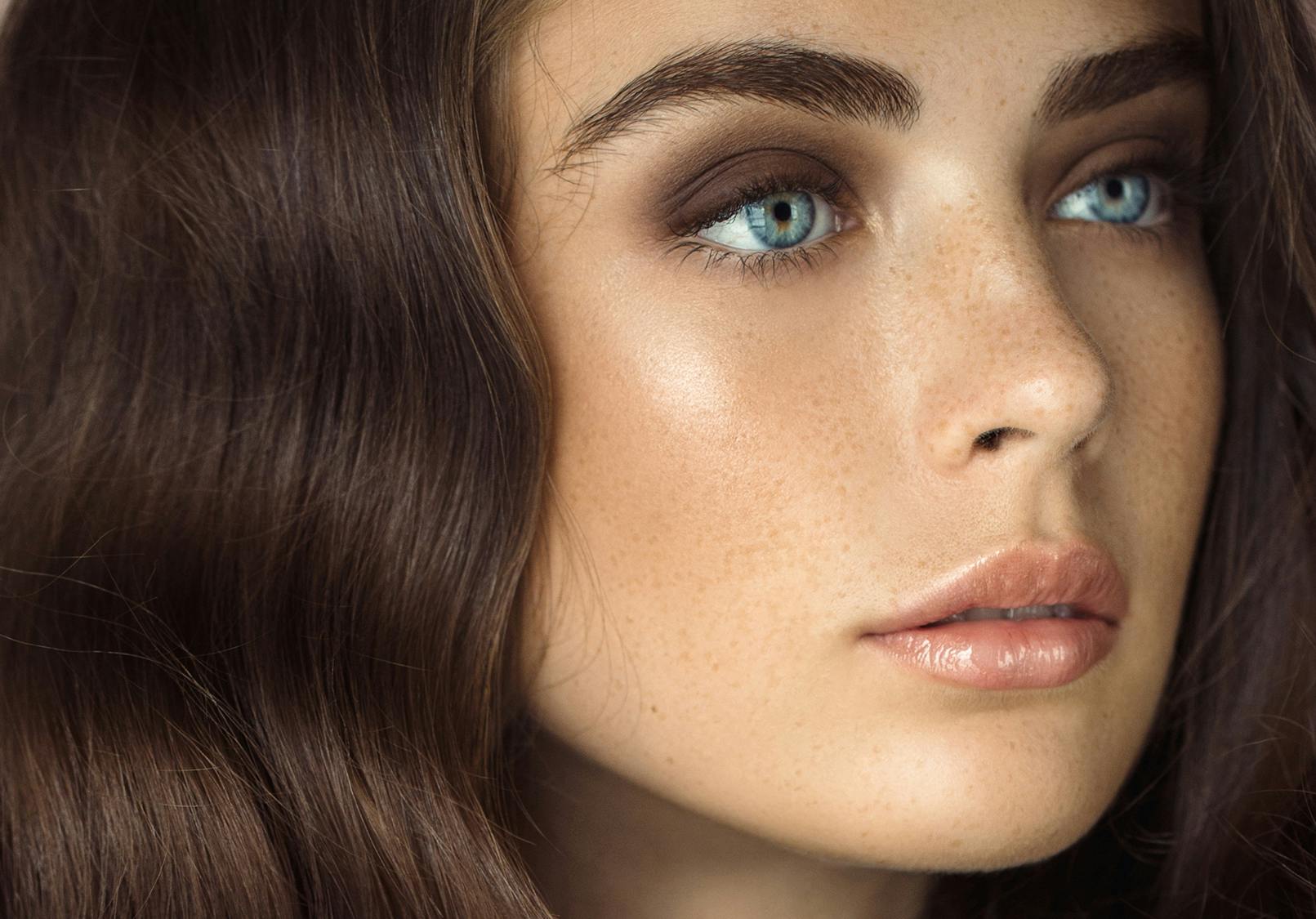 Face of alluring woman with defined features.