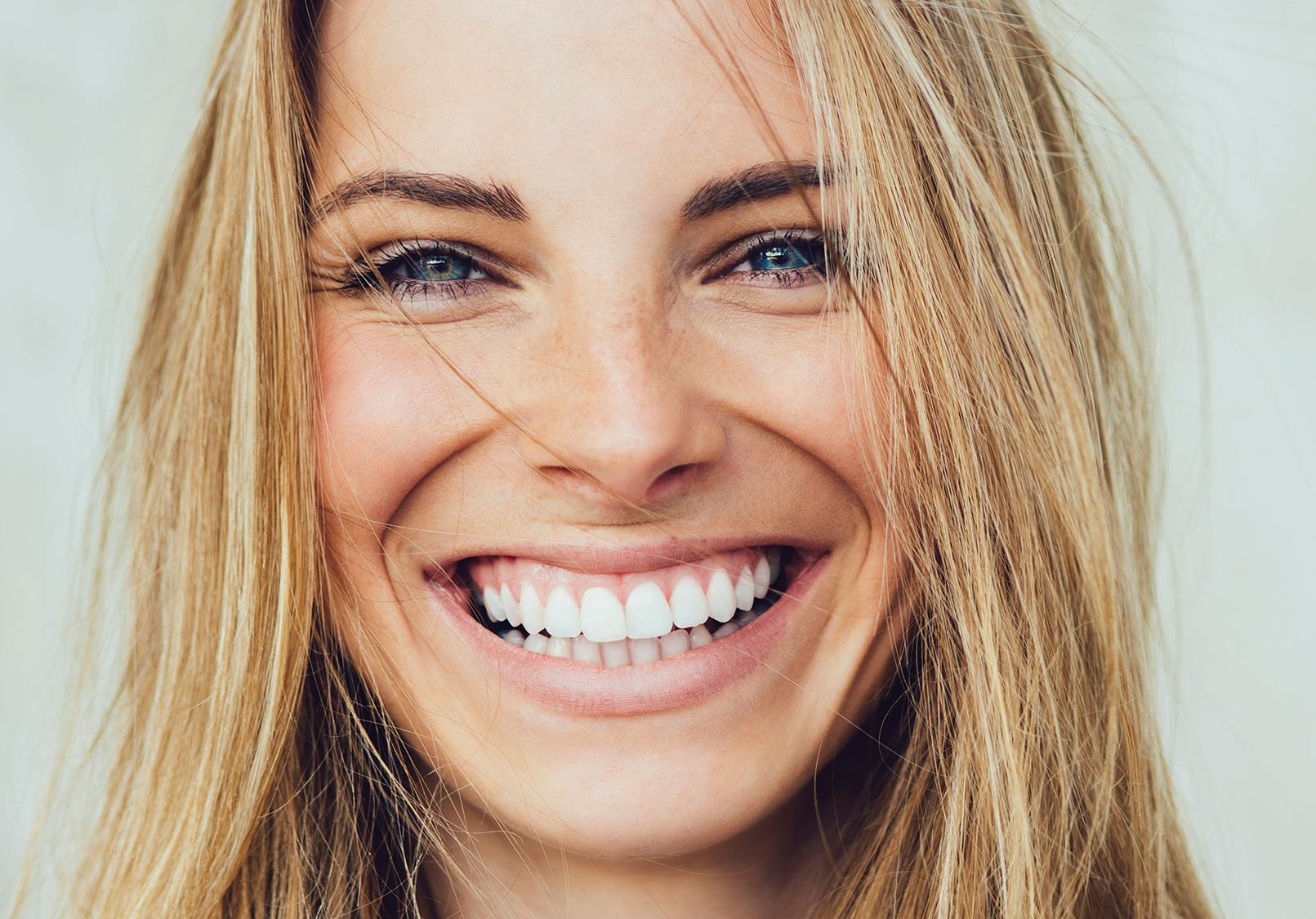 Close up on young woman with a big smile.