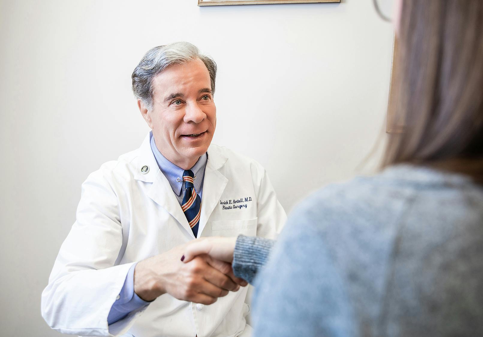 Dr. Antell shaking hands with patient.