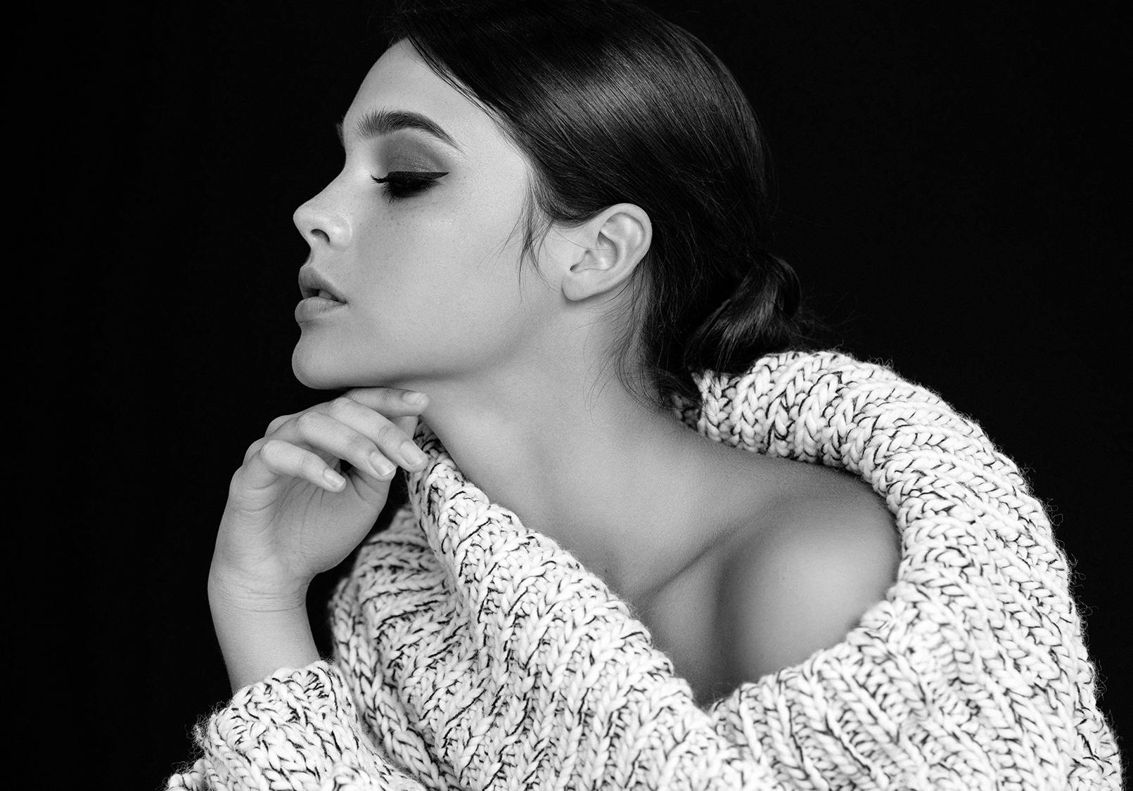 Profile of woman with defined chin and beautiful skin.