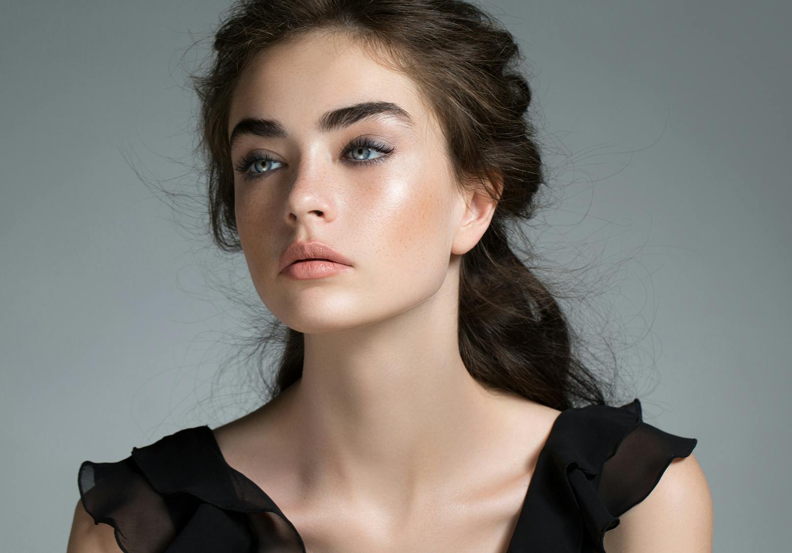 Elegant young woman with beautiful skin.