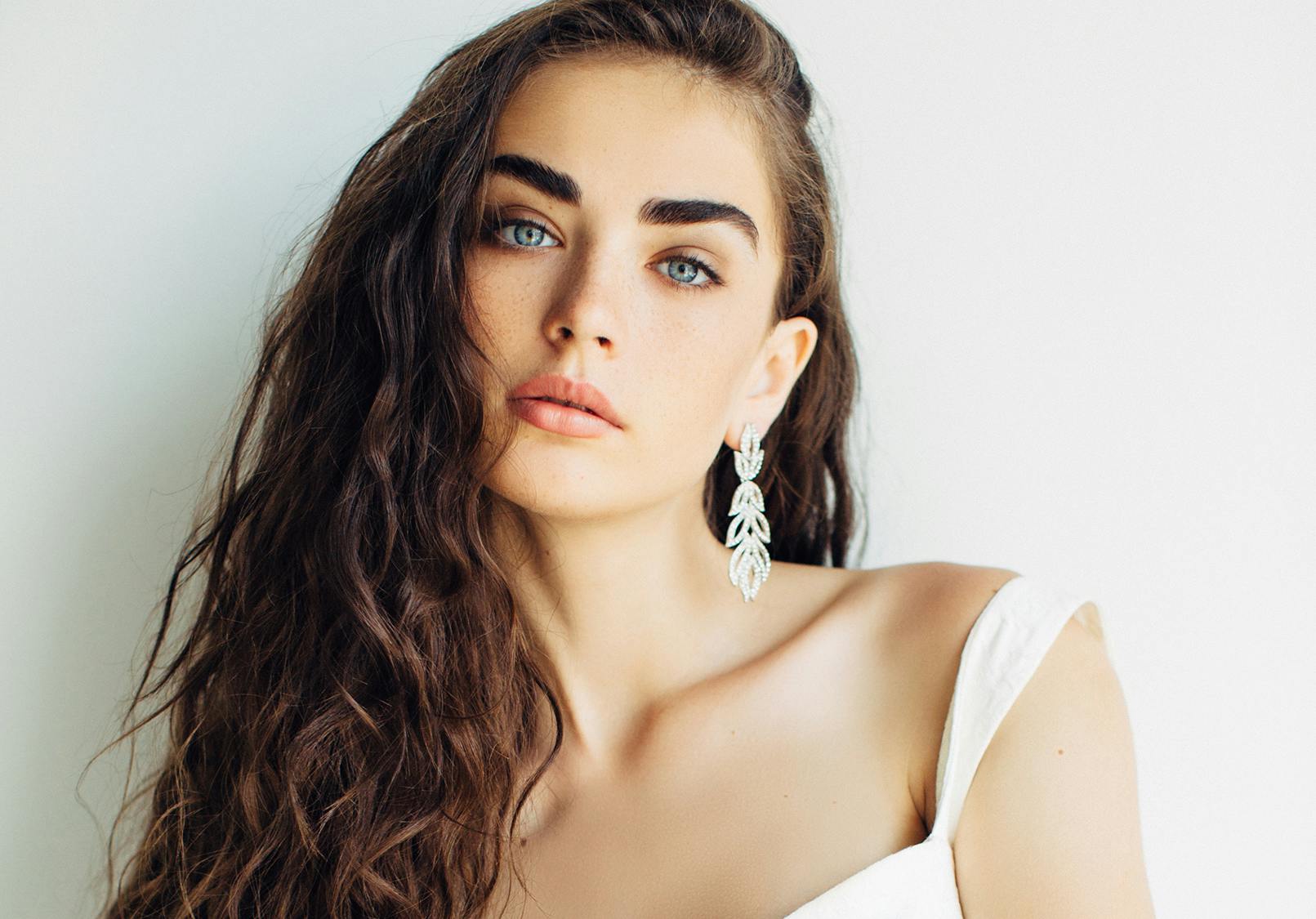 Close up of gorgeous woman with smooth even skin.