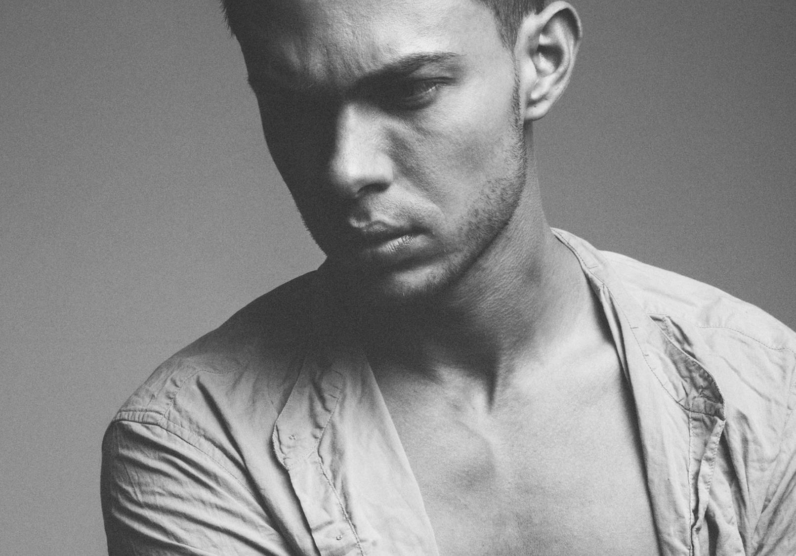 Handsome man in black and white photo.