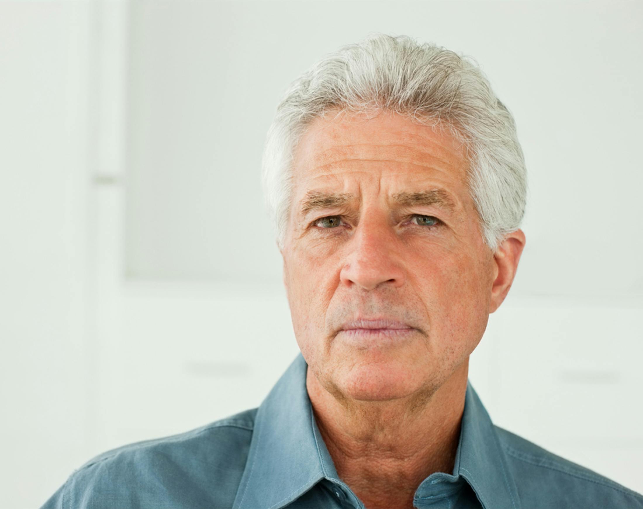 older man looking into the camera