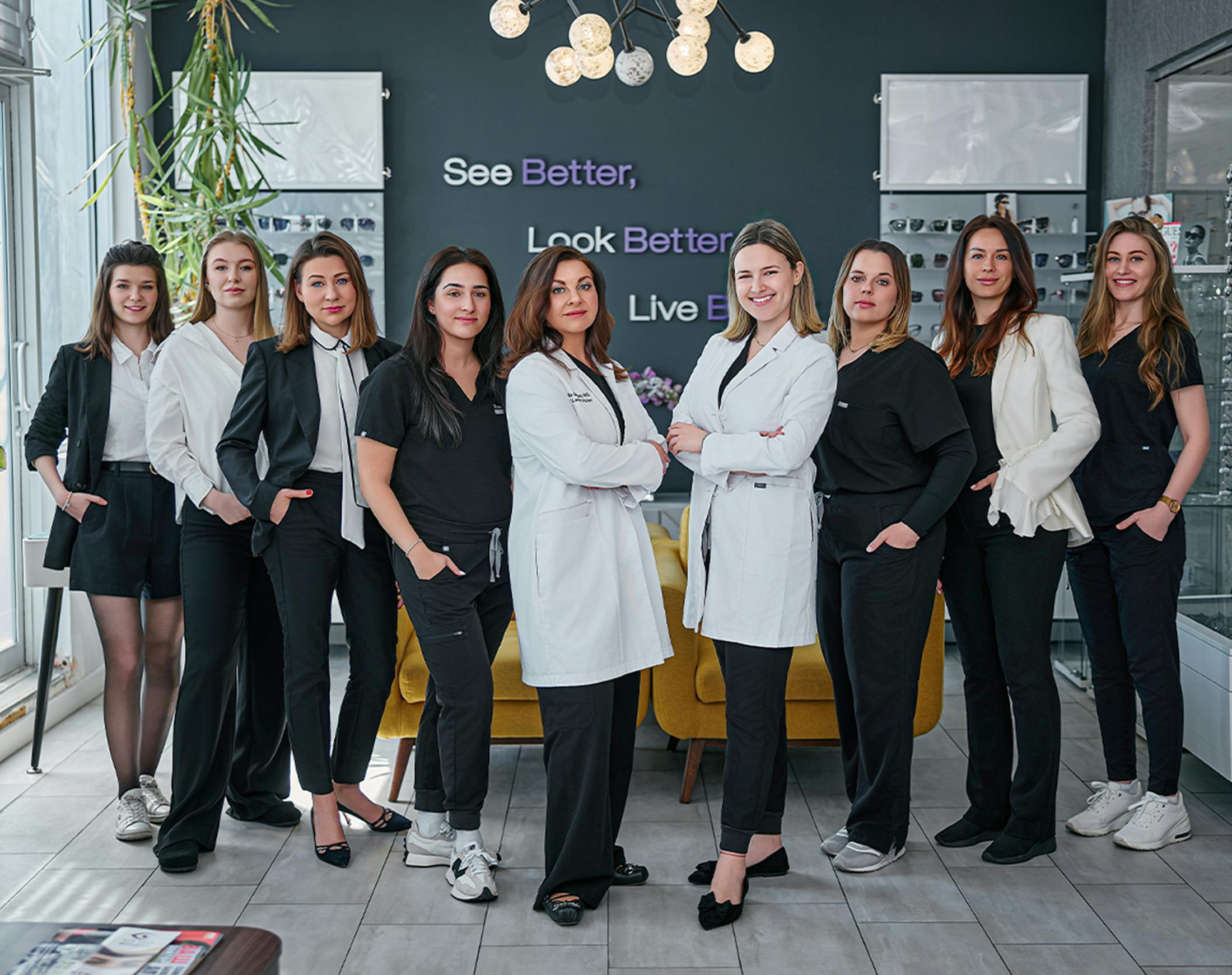 all nine staff members standing together