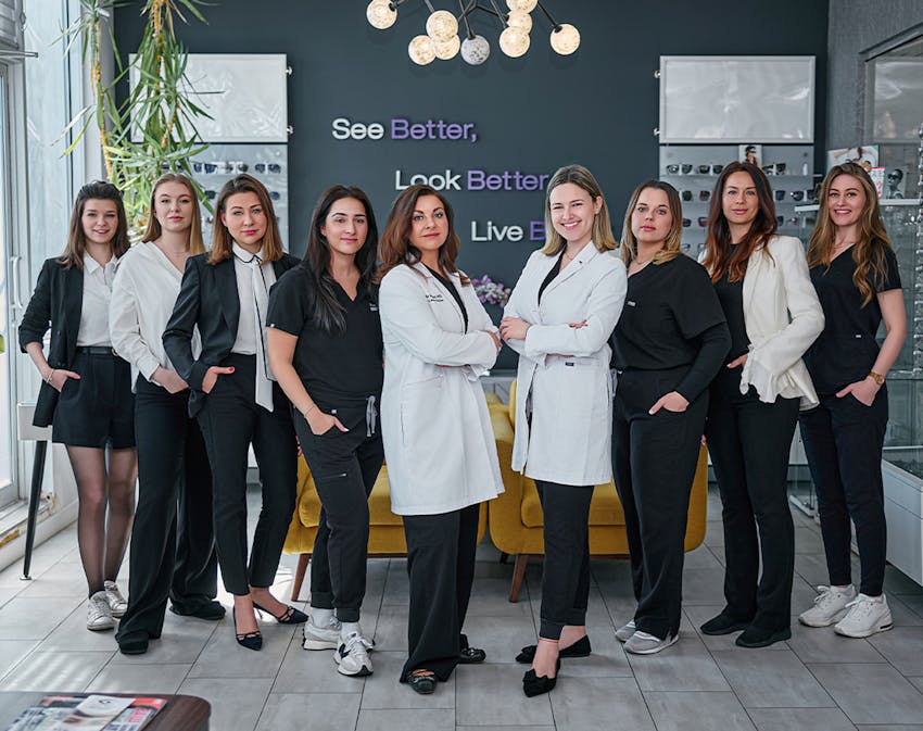 all nine staff members standing together