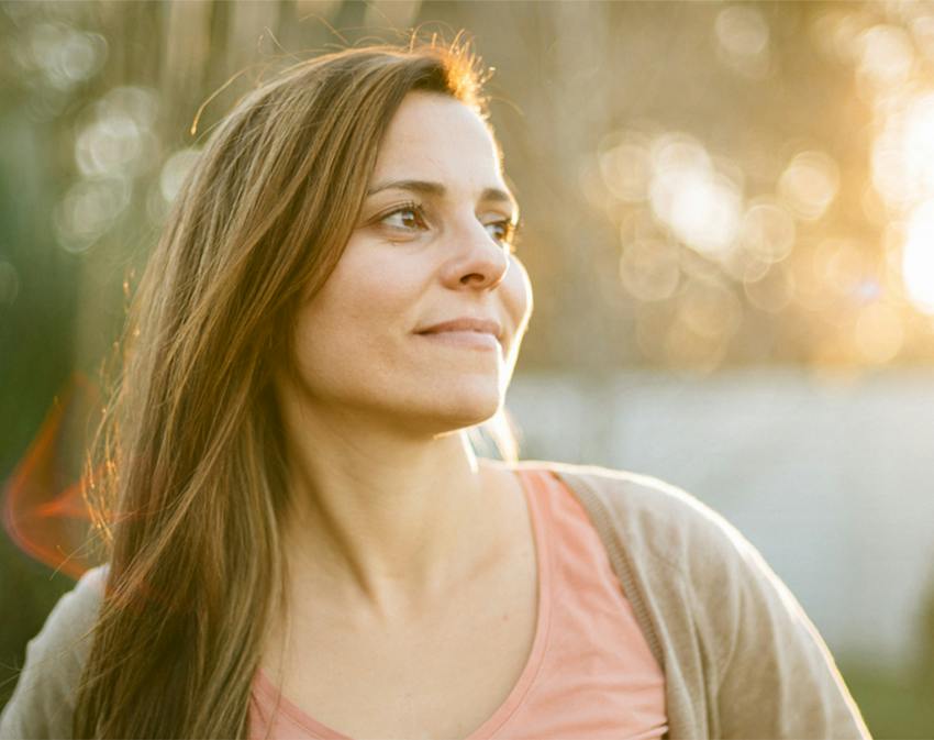 woman smiling to the side