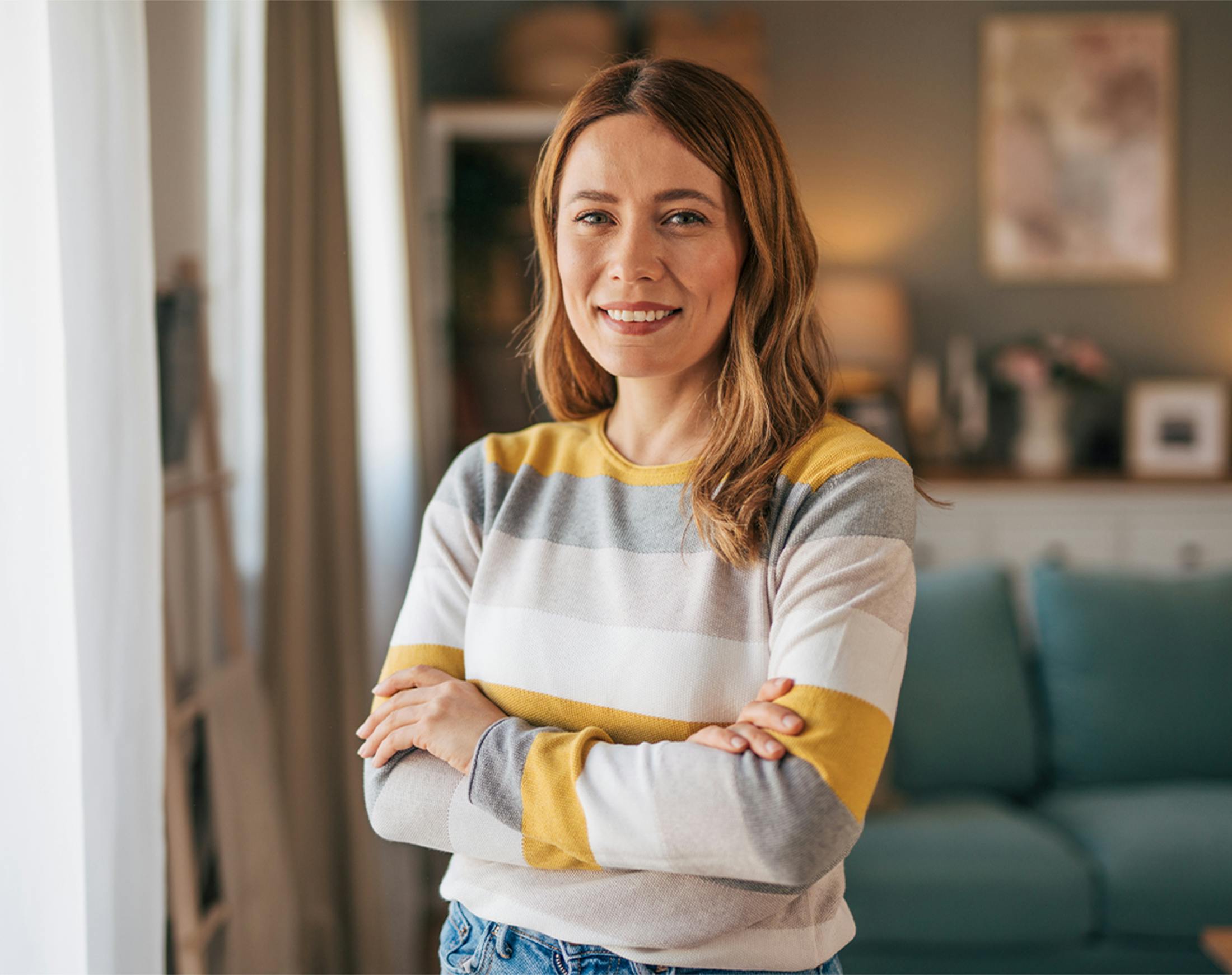 smiling woman crossing her arms
