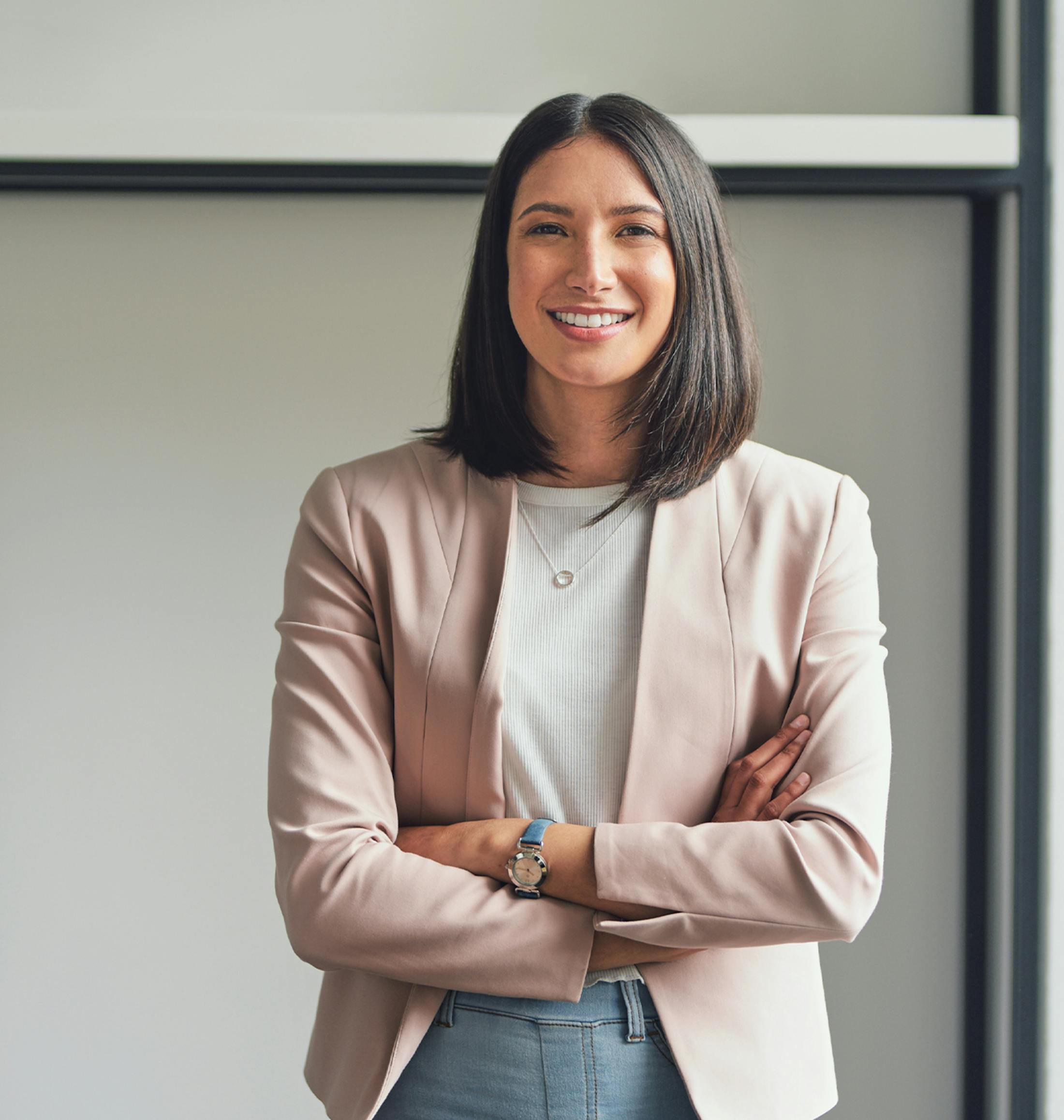 smiling woman crossing her arms