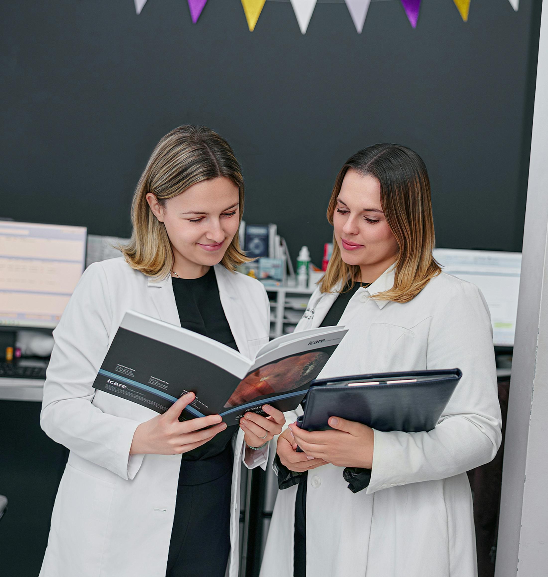 two doctors looking at paperwork