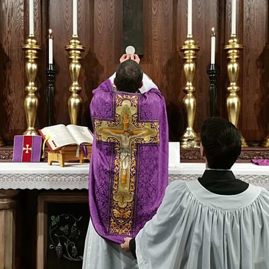 A priest of the Servants of the Holy Family offering the Holy Sacrifice of the Mass