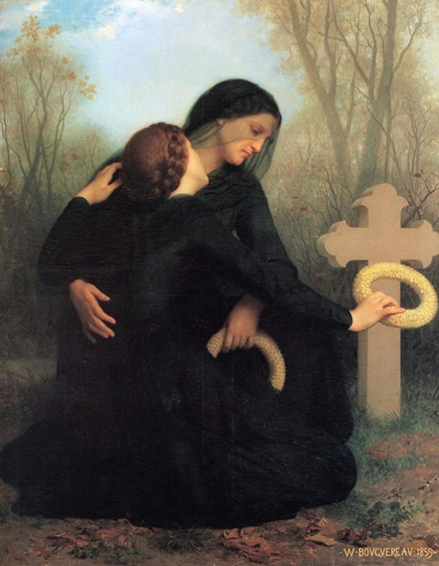 Two women in mourning embrace beside a cross, one laying a wreath on it