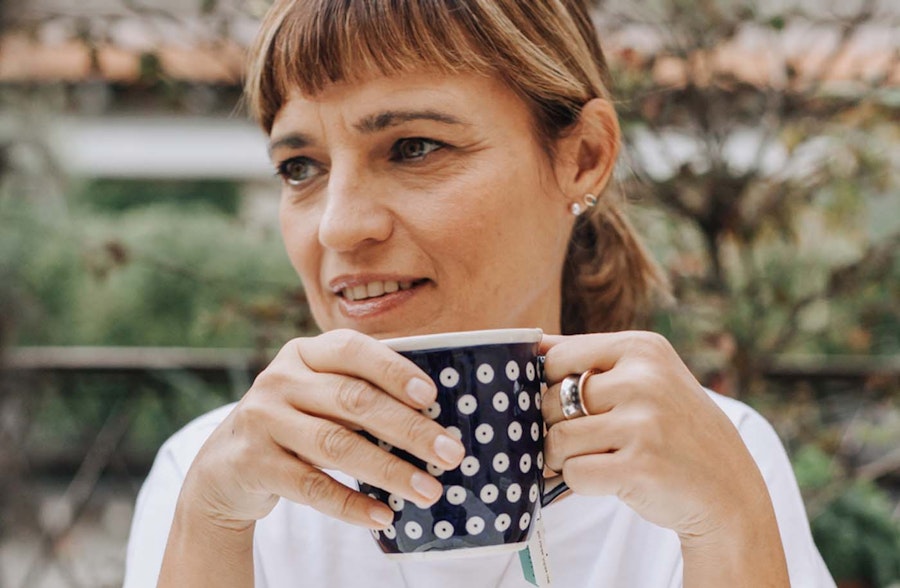What is the menopause? Woman drinking from a coffee cup. 