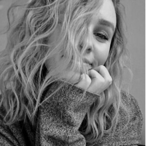 image of Katia with her hair over her face in black and white