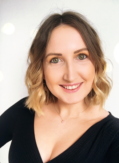 Bryony smiling in a black dress