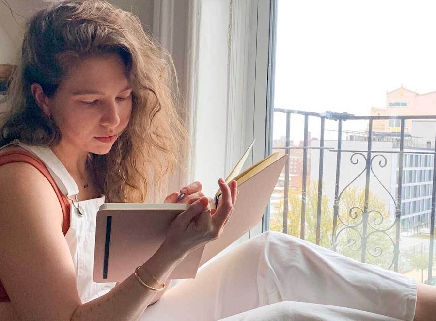 picture of Molly writing in her journal