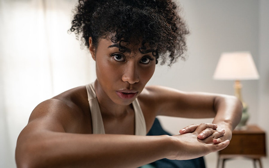 woman doing exercises for period cramps